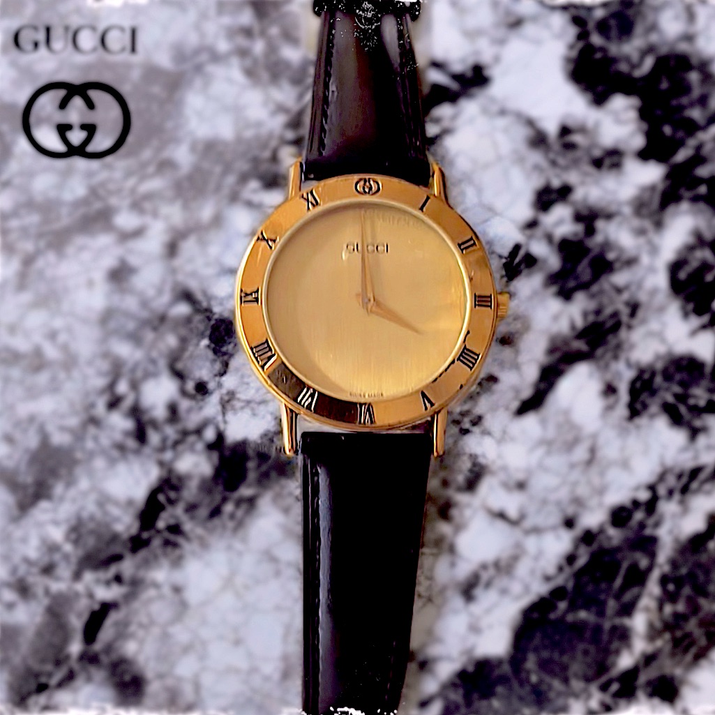 Authentic Gucci 3000.2.M Gold Watch With Black Leather Wristband Mint Condition.